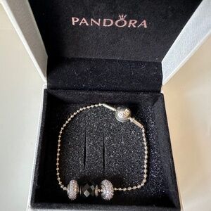 Pandora essence bracelet with 3 charms
